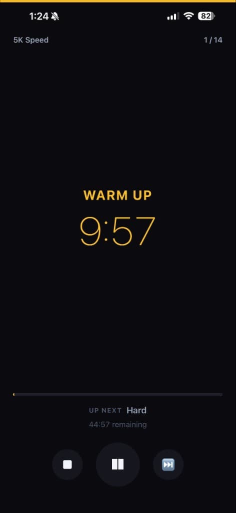 PaceCue active workout timer showing warm up countdown at 9:57